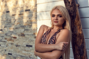 Young blonde in summer open studio