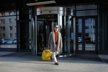 Man with a yellow suitcase.