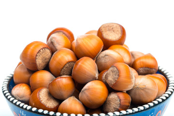 Hazelnuts in bowl  isolated on white background - Image