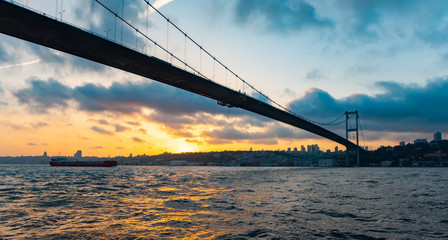Bosphorus Sultan Mehmet Bridge in Istanbul at sunset. Turkey