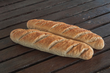 Baguette on a wooden table.