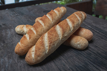Baguette on a wooden table.