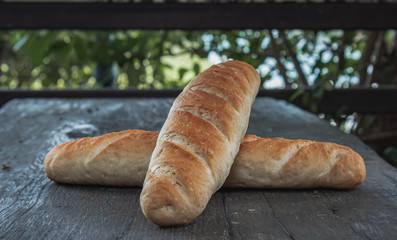 Baguette on a wooden table.