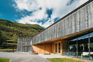 Obraz premium Borgund, Norway. Visitor Center Near Stavkirke An Old Wooden Triple Nave Stave Church In Summer Day