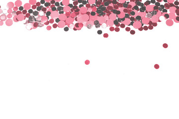 Silver and pink glitter on white background, shiny confetti