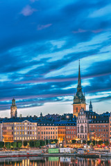 Fototapeta premium Stockholm, Sweden. Scenic View Of Skyline At Evening Night. Tower Of Storkyrkan - The Great Church Or Church Of St. Nicholas And German St Gertrude's Church. Famous Popular Destination In Night