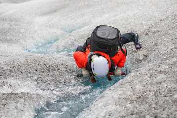 People action show a drinking water in the glacier at Iceland, Summertime