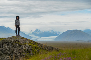 Fototapeta premium Picture of asian woman solo travel enjoy at nature on the top mountain with Skaftafellsjokull glacier as a Background in Iceland
