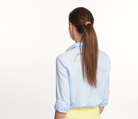 Woman with ponytail hair style rear view