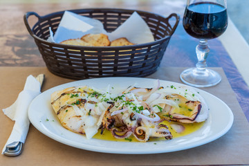 European cuisine, Mediterranean dish. Grilled squid with oyster sauce, Greece