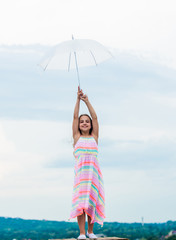 Fairy tale character. Feeling light. Girl with light umbrella. Anti gravitation. Fly drop...