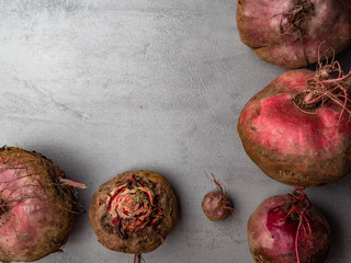 Fresh harvested beetroots, homegrown organic beets on concrete background
