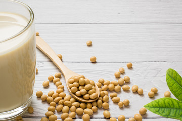 Soy milk and soy bean it on white table background,healthy concept. Benefits of Soy.