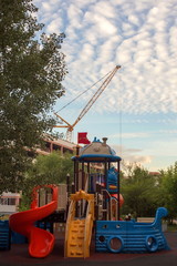 The crane, a children's Playground and the sky in the clouds