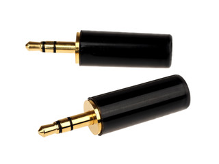 A group of gold plated, 3.5mm black headphone jacks isolated on white