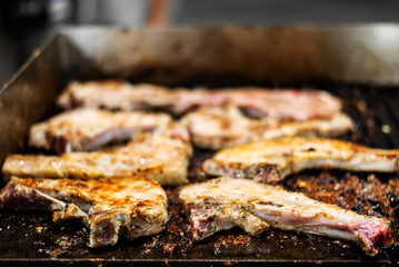 close up roasted pork steak in frying pan