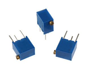 Close-up view of a group of adjustable trimmer potentiometers, isolated on a white background