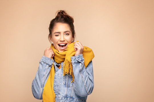 Happy Girl In Autumn Yellow Scarf.