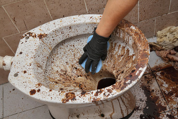 Dirty toilet and bathroom
