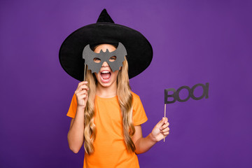 Photo of little witch lady play paranormal role halloween theme party holding bat paper stick scary...