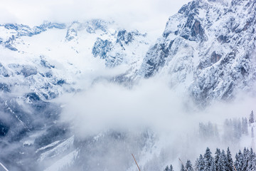 winter in the mountains with laouds and snow 