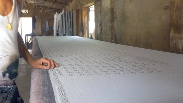 Block Printing - Shot of printing cloth with carved wooden blocks. 