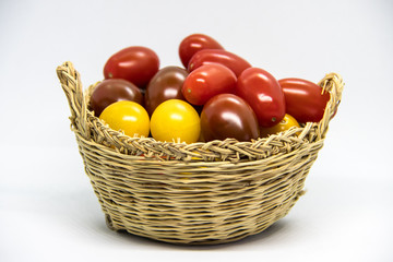 Fresh and colorful cherry tomatoes on white background