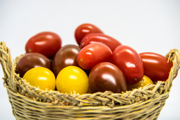 Fresh and colorful cherry tomatoes on white background
