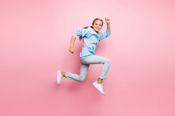 Fototapeta na wymiar Full body profile photo of pretty little lady jumping high running to finish line believe in victory rushing fast wear casual outfit isolated pastel pink color background