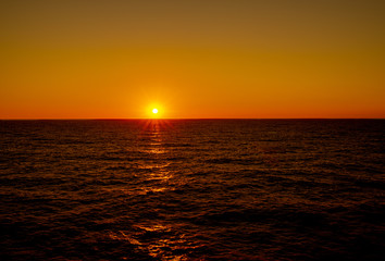 sunset over the ocean with an endless horizon 