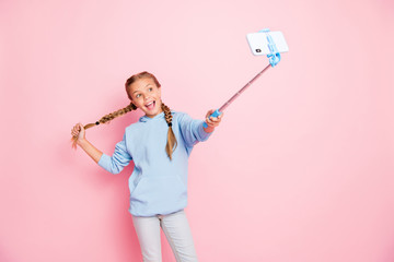 Photo of pretty little lady holding metal stick mono pod making selfies for youth famous blog wear...