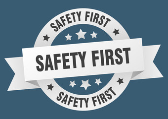 safety first ribbon. safety first round white sign. safety first