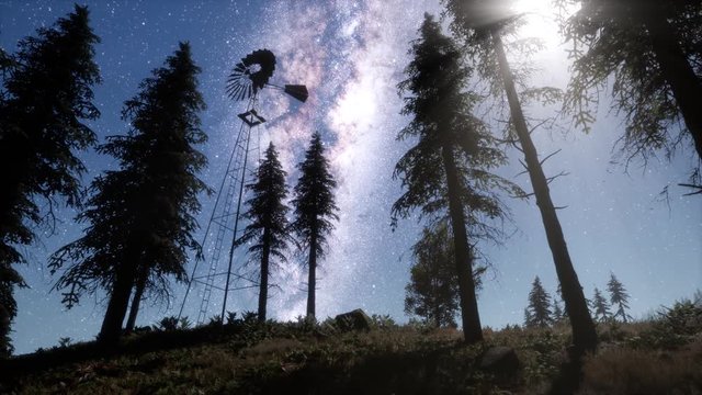 retro windmill in mountain forest with stars. hyperlapse