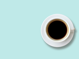 Top view of Black coffee in white cup isolated on the pastel blue background. Copy space and pastel concept.