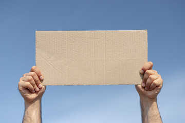 Protester holding board with mock-up