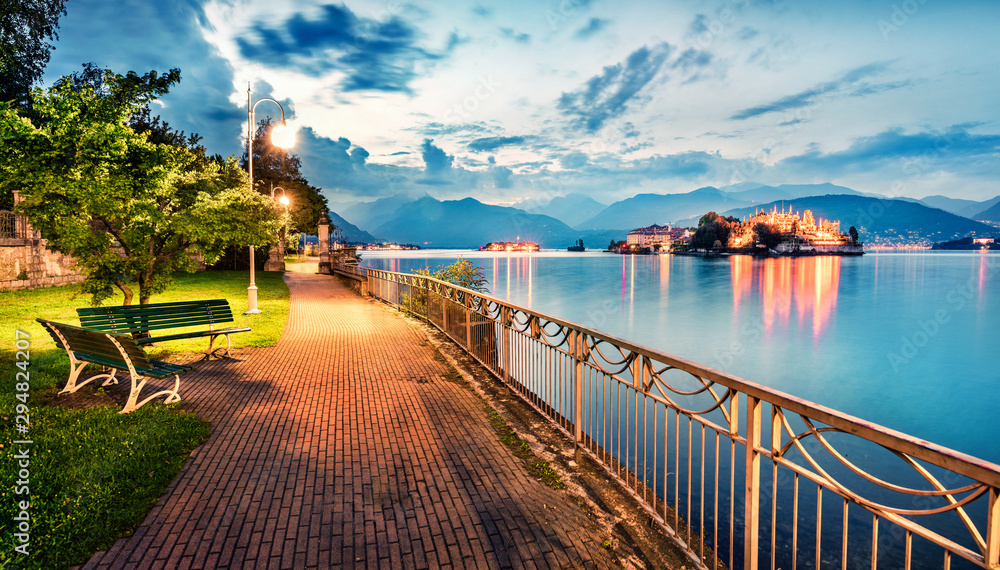 Poster splendid evening cityscape of stresa town. wonderful summer susnset on maggiore lake with bella isla