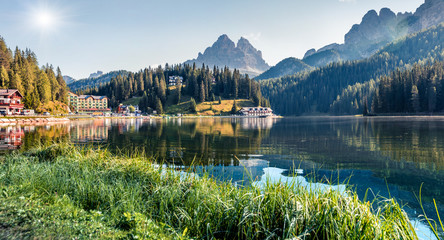 Sunny summer view of Misurina lake. Attractive morning scene of National Park Tre Cime di Lavaredo, Location Auronzo, Misurina resort, Dolomiti Alps, South Tyrol, Italy, Europe.