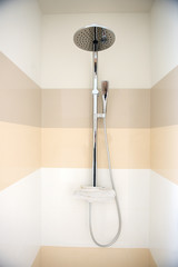 Full Chrome Shower Head Isolated in home bathroom interior