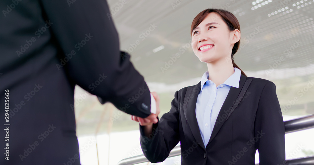 Wall mural businesswoman handshake with smile