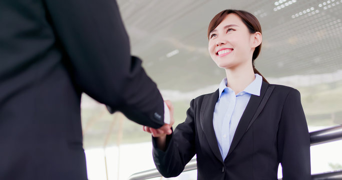 Businesswoman handshake with smile