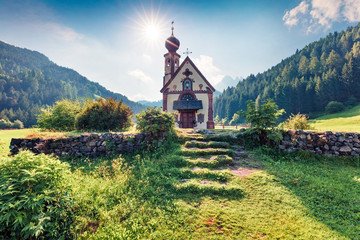 Splendid morning view of San Giovanni Church in St. Magdalena village. Dolomiti Alps, Bolzano, South Tyrol, Italy. Europe.