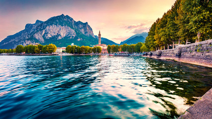 Fantastic summer sunrise of Como lake. Splendid morning cityscape of central park of Lecco town, Italy, Europe. Traveling concept background. - obrazy, fototapety, plakaty
