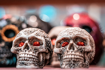 Dia de los muertos, close up of traditional decorative skulls. Mexican folklore, hispanic vibes, dark ritual and halloween themes. 