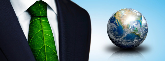 Ecology concept, business man with green leaf tie and earth planet - Elements of this image furnished by NASA