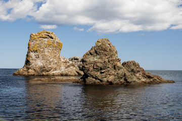 Fototapeta na wymiar A beautiful rock formations near the coast of the Sea of Okhotsk. Cape Velikan, island Sakhalin, Russia