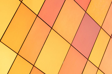Bright orange and multicolored tile of different size for interior and exterior design, diagonal view.