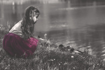 Girl by the lake - selective color photo