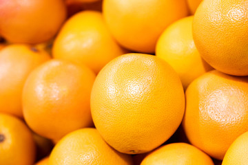 Grapefruit harvest. pile of grapefruit. grapefruits for food textures and backgrounds. A backdrop of grapefruits. Street vegetable farmer's market