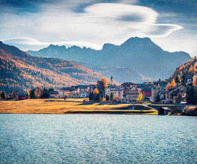 Stunning autumn cityscape of Silvaplana town. Splendid morning view of Lake Champfer, Upper Engadine in the Swiss canton of the Grisons, Switzerland, Europe. Traveling concept background.