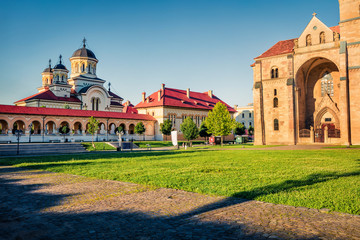 Fototapeta na wymiar Attractive summer view of Coronation Orthodox Cathedral in Fortress Of Alba Iulia. Picturesque evening scene of Transylvania, Iulia Alba city, Romania, Europe. Traveling concept background.